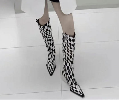Black and white checkered knee-high boots worn by a person on a light gray floor.