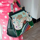 Exquisite Serpentine Pattern Handbag with Embellishments