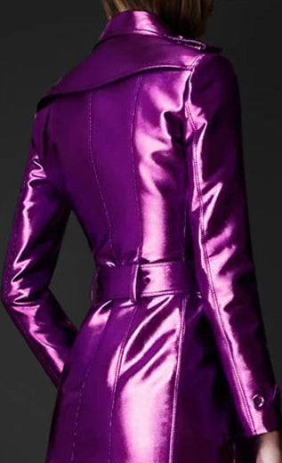 Purple metallic trench coat with a belt on a black background