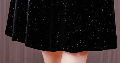 Black skirt with star pattern worn by a person against a neutral background