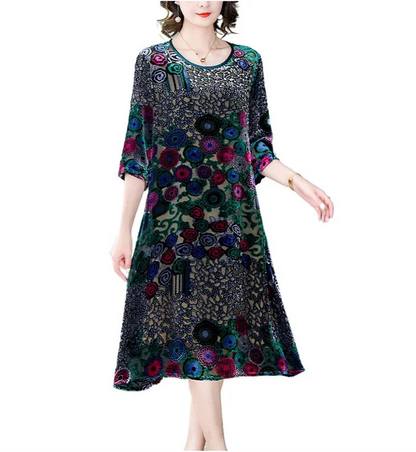 Woman wearing a colorful floral dress on a white background