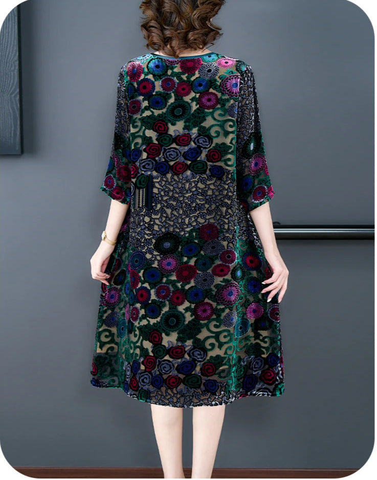 Woman wearing a floral dress with a gray background