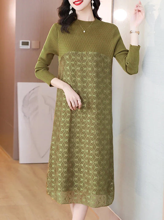 Woman wearing a green dress with a subtle pattern in an indoor setting