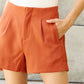 Pleated High Waisted Shorts in Ochre