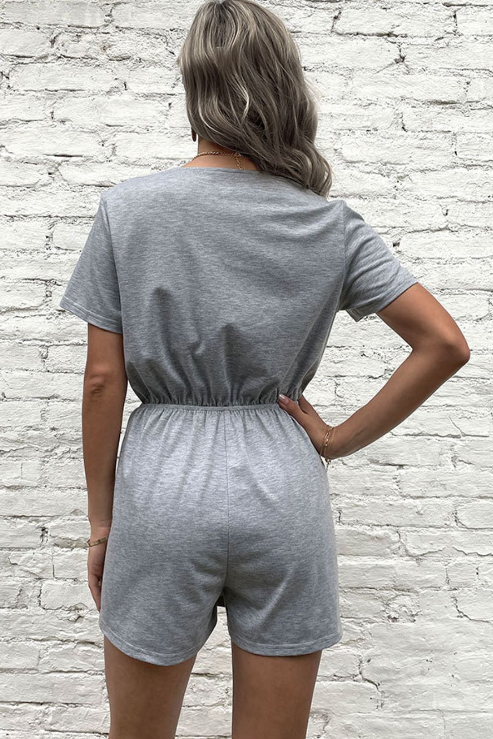 Woman wearing Gray Buttoned & Drawstring Romper