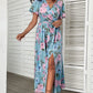 Woman wearing floral print side slit surplice maxi dress