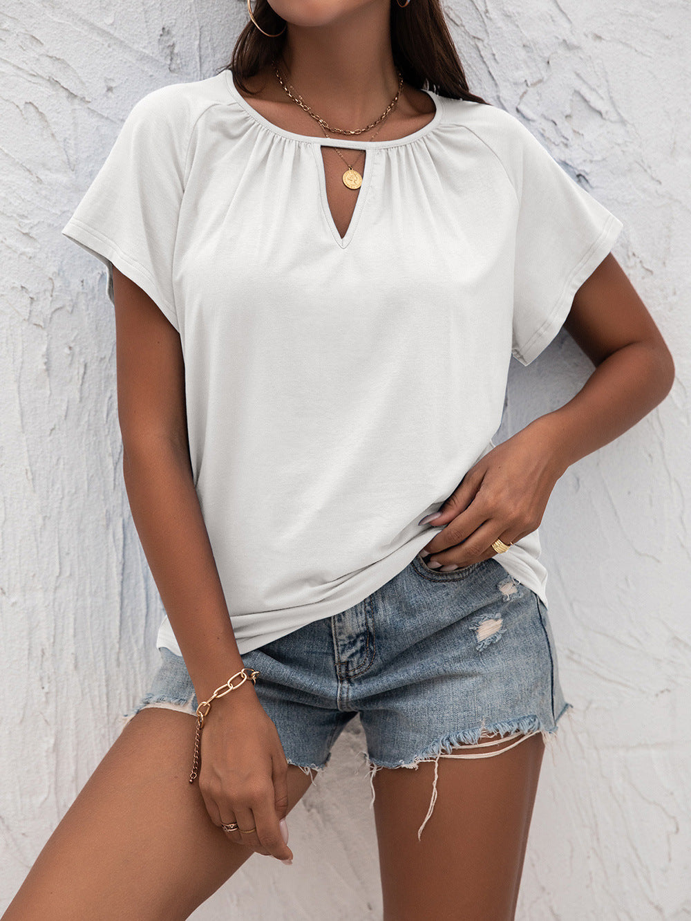 Woman in White Cutout Round Neck T-Shirt