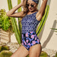 Woman wearing navy blue mixed print one-piece swimsuit