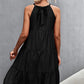 Woman wearing Black Grecian Tiered Sleeveless Midi Dress