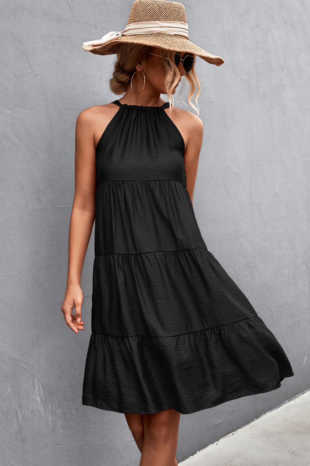 Woman wearing Black Grecian Tiered Sleeveless Midi Dress
