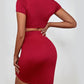 Woman wearing Red Cropped Top & Ruched Mini Skirt Set